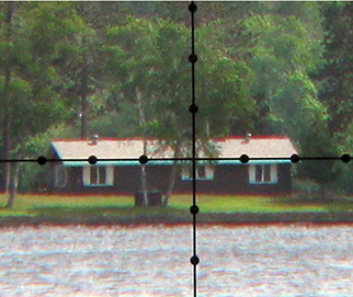 magnified reticle view of house